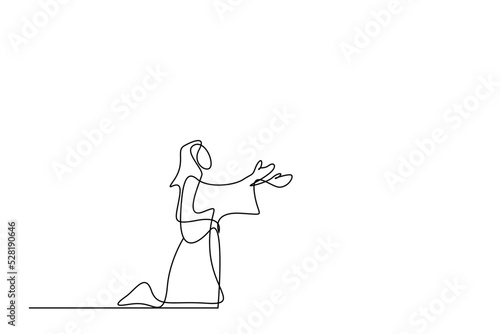 a person is on his knees praying with open hands