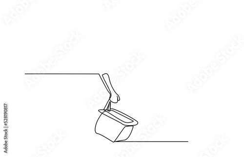 a person starts shopping by carrying an empty shopping cart