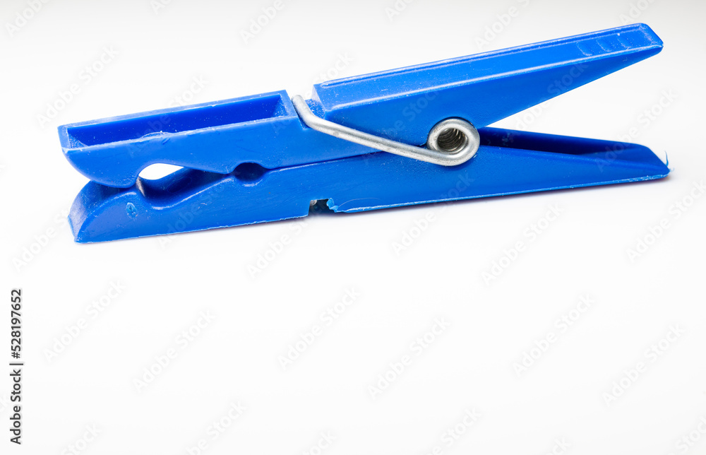 close up of blue plastic clothes pegs isolated on white background close up of blue plastic clothes pegs isolated on white background