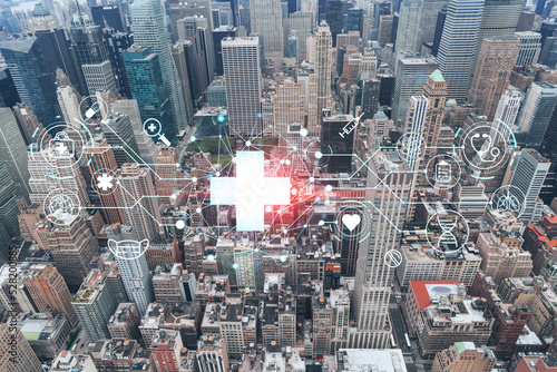 Aerial panoramic roof top city view of New York City Financial Downtown district  day time. Manhattan  NYC  USA. Health care digital medicine hologram. The concept of treatment and disease prevention