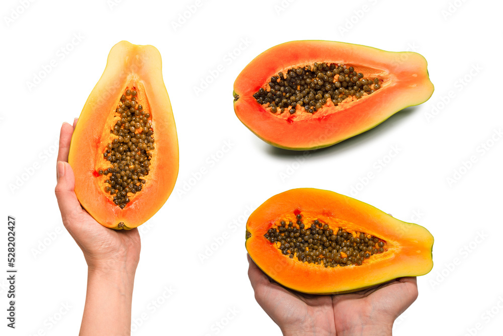 Papaya fruit isolated on a white background in woman hands. Half papaya. Papaya fruit isolated on a white background in woman hands. Half papaya.