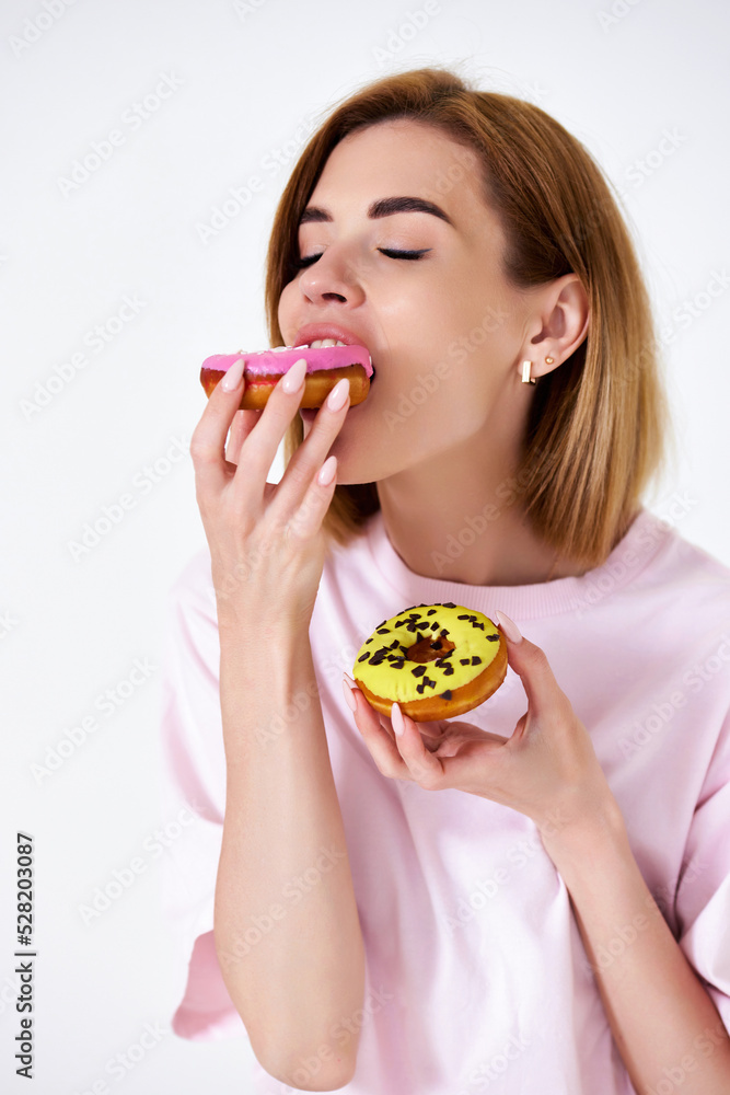 beautiful blonde woman with donuts on white background. beautiful blonde woman with donuts on white background.