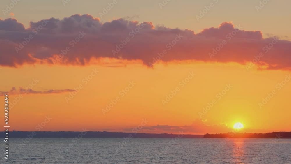 Sunset in the river Dnipro, Ukraine. Ukrainian river Dnipro. Sunset in the Ukrainian river Dnipro. Beautiful sunset on the river, the sun reflects off the water Sunset in the river Dnipro, Ukraine. Ukrainian river Dnipro. Sunset in the Ukrainian river Dnipro. Beautiful sunset on the river, the sun reflects off the water