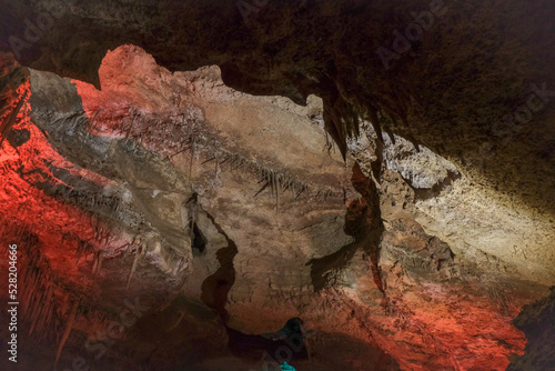 Magic and mystical lighting inside Cave of the Winds stalactite cavity hollow attraction near Colorado Springs in mountains with rock formations light shadow stone beauty nature landscape