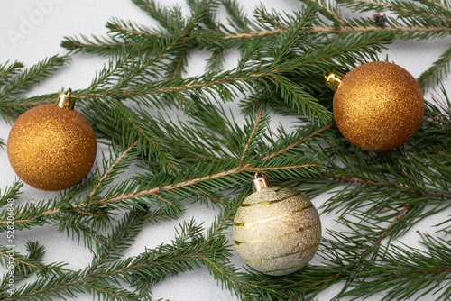 Golden Christmas balls on fir branches