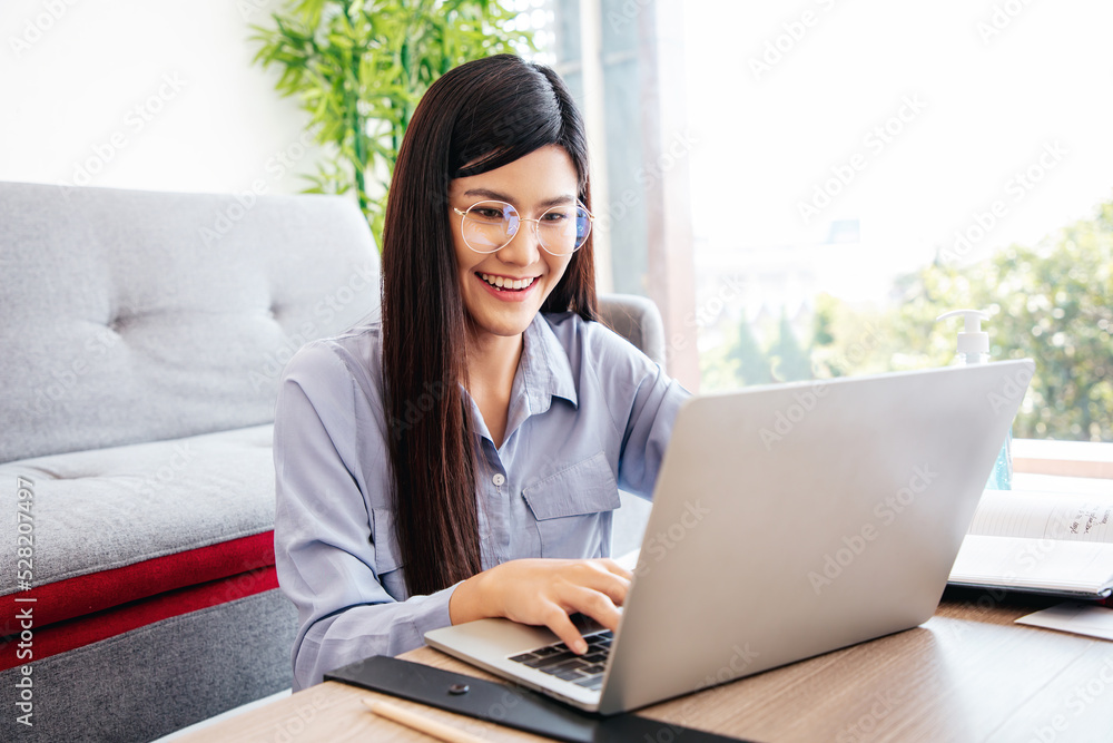 Young Cute Woman feels happy and Excited while video call Meeting on Work For Home Period. Copy Space. Young Cute Woman feels happy and Excited while video call Meeting on Work For Home Period. Copy Space.