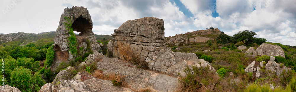 Beautiful panoramic view of the rock formations of the Los Alcornocales Natural Park, located on the Ruta del Toro, near the town of Los Barrios, in the Andalusian province of Cadiz, Spain.