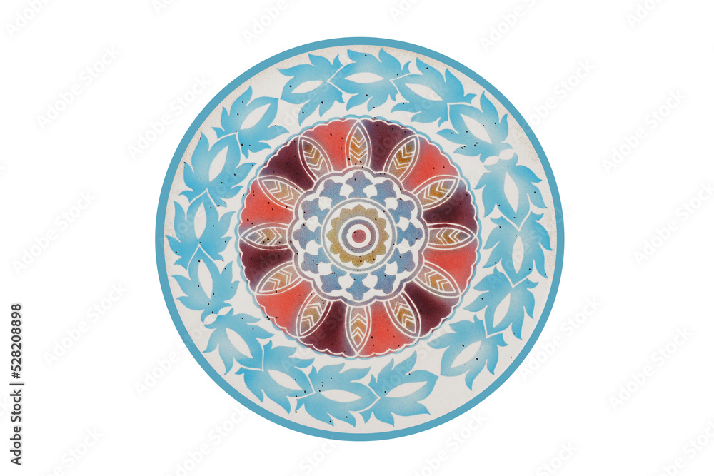 This is a photograph of a floral pattern handmade decorated tile in a circle on a lounge chair as a popular vintage art decoration