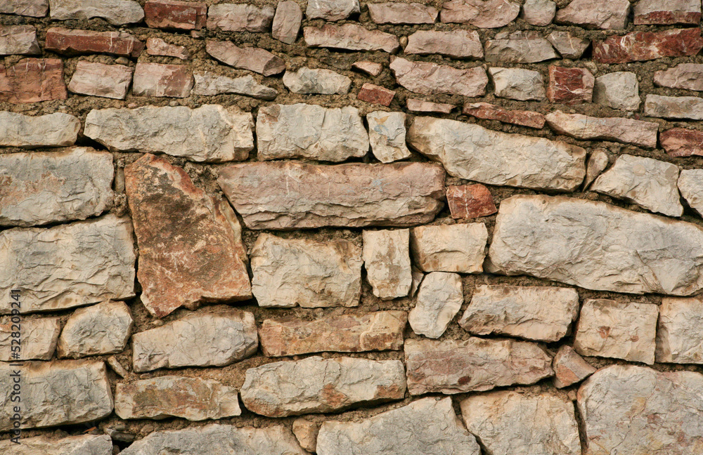 Natural stone wall texture background, close-up. Natural stones surface texture pattern for wallpaper. Stone wall for backdrop for publication, poster, screensaver, wallpaper, postcard, banner, cover Natural stone wall texture background, close-up. Natural stones surface texture pattern for wallpaper. Stone wall for backdrop for publication, poster, screensaver, wallpaper, postcard, banner, cover