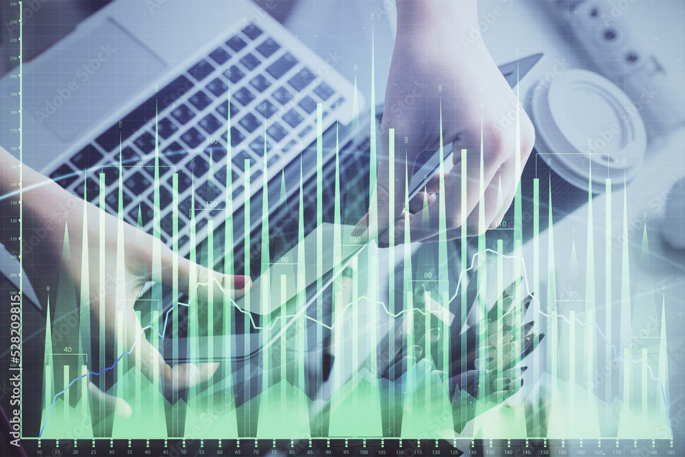 Double exposure of businesswoman hands typing on computer and financial graph hologram drawing. Stock market analysis concept. Double exposure of businesswoman hands typing on computer and financial graph hologram drawing. Stock market analysis concept.