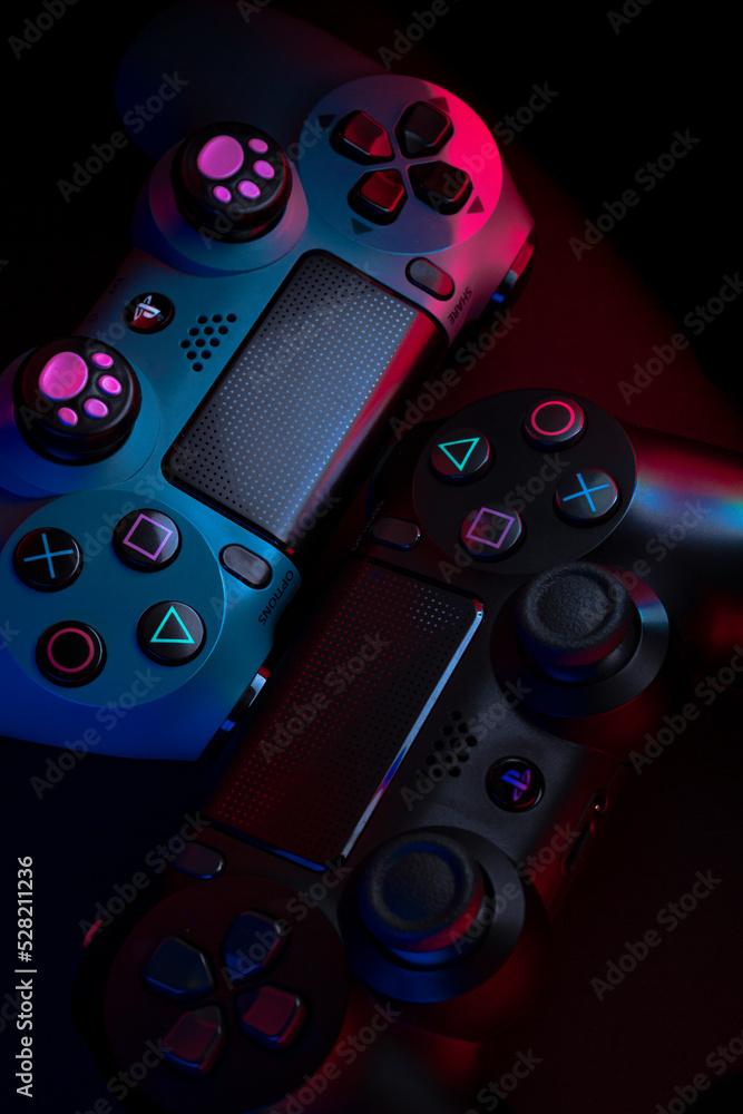 MÁLAGA - SPAIN - FEBRUARY 16, 2020: Playstation 4 Gamepad on black  background with color lights. Sony PS4 Dualshock V2. Studio Shot. Stock  Photo | Adobe Stock