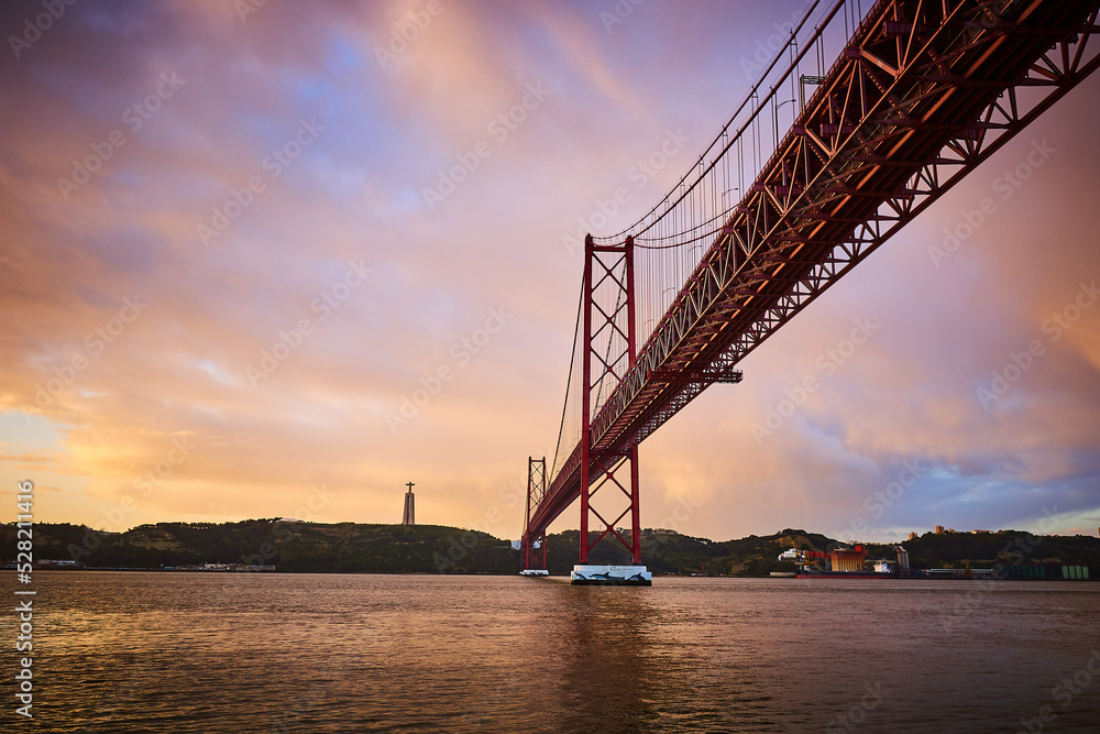 Fototapeta premium April 25th Bridge in Lisbona, Portugal, at sunrise