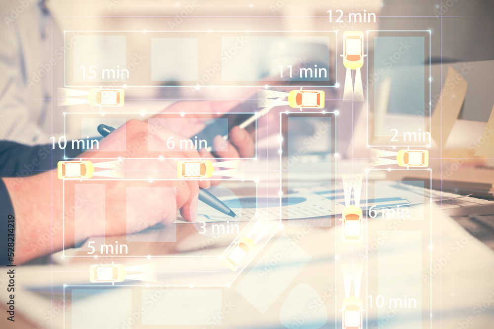 Double exposure of man's hands holding and using a digital device and automobile theme hologram drawing. Technology concept. Double exposure of man's hands holding and using a digital device and automobile theme hologram drawing. Technology concept.