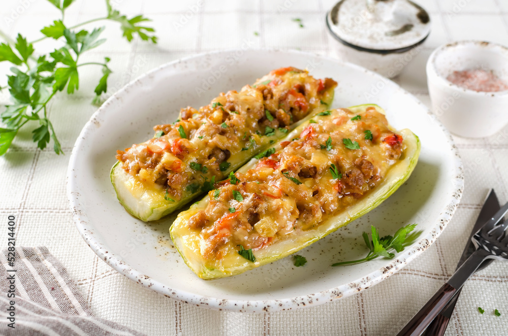 Zucchini stuffed with minced meat and tomatoes and cheese. Zucchini stuffed with minced meat and tomatoes and cheese.