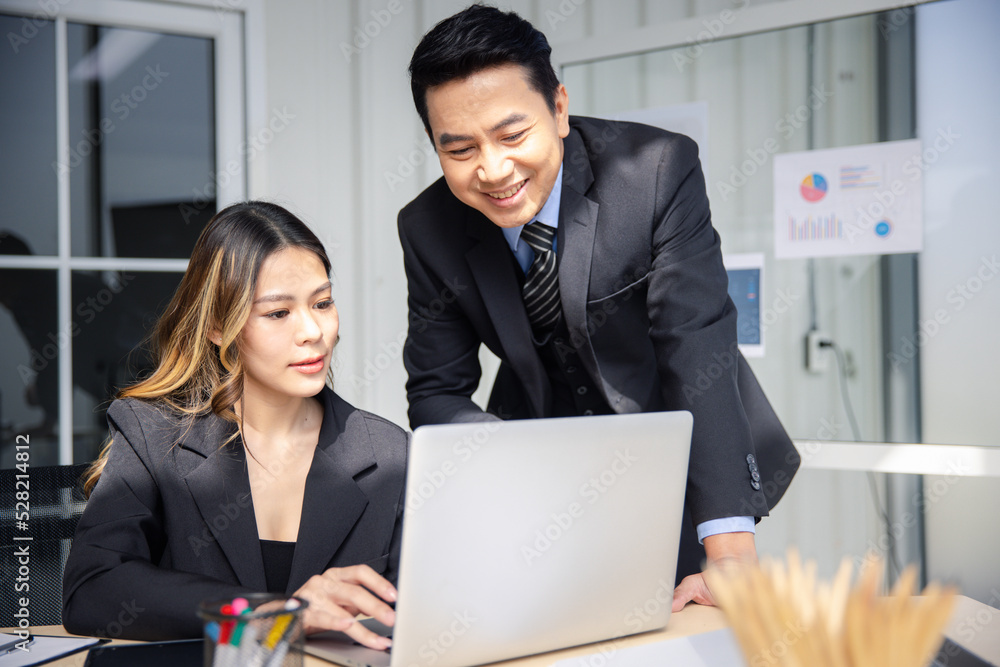 Businessman or manager with formal suit in presentation meeting or mentor with employee or colleague in modern office Businessman or manager with formal suit in presentation meeting or mentor with employee or colleague in modern office