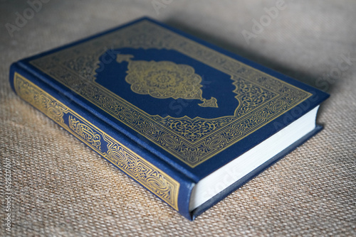 Canvas Print Indonesia - July, 2022 : The Quran, also romanized Qur'an or Koran, is central religious text of Islam, believed by Muslims to revelation from God (Allah)