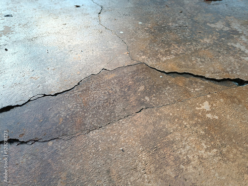 Cracked concrete ground broken at floor home or street road subside from earthquake