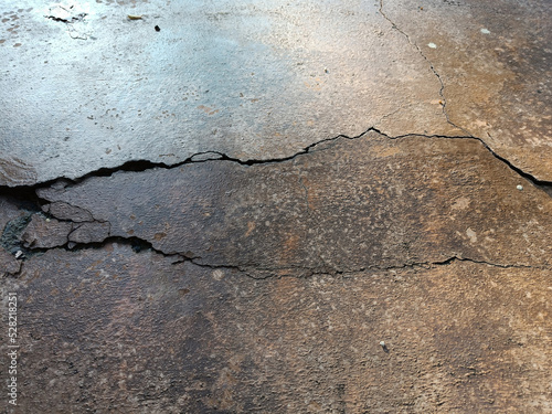 Bild auf Leinwand Cracked concrete ground broken at floor home or street road subside from earthqu
