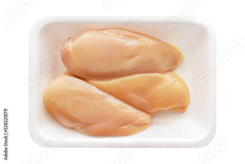 Raw chicken breast fillet on a white foam meat tray on white background. 