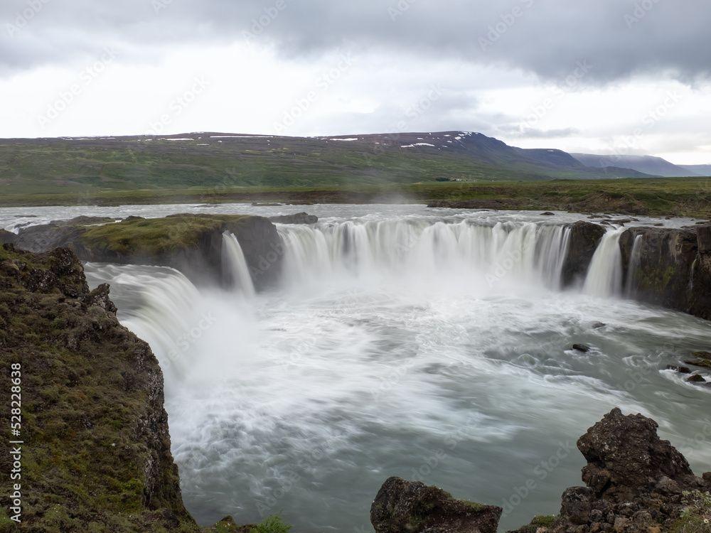Goðafoss waterfall in northern Iceland, located along the country's main ring road. The water of the river Skjálfandafljót falls from a height of 12 metres over a width of 30 metres. Goðafoss waterfall in northern Iceland, located along the country's main ring road. The water of the river Skjálfandafljót falls from a height of 12 metres over a width of 30 metres.
