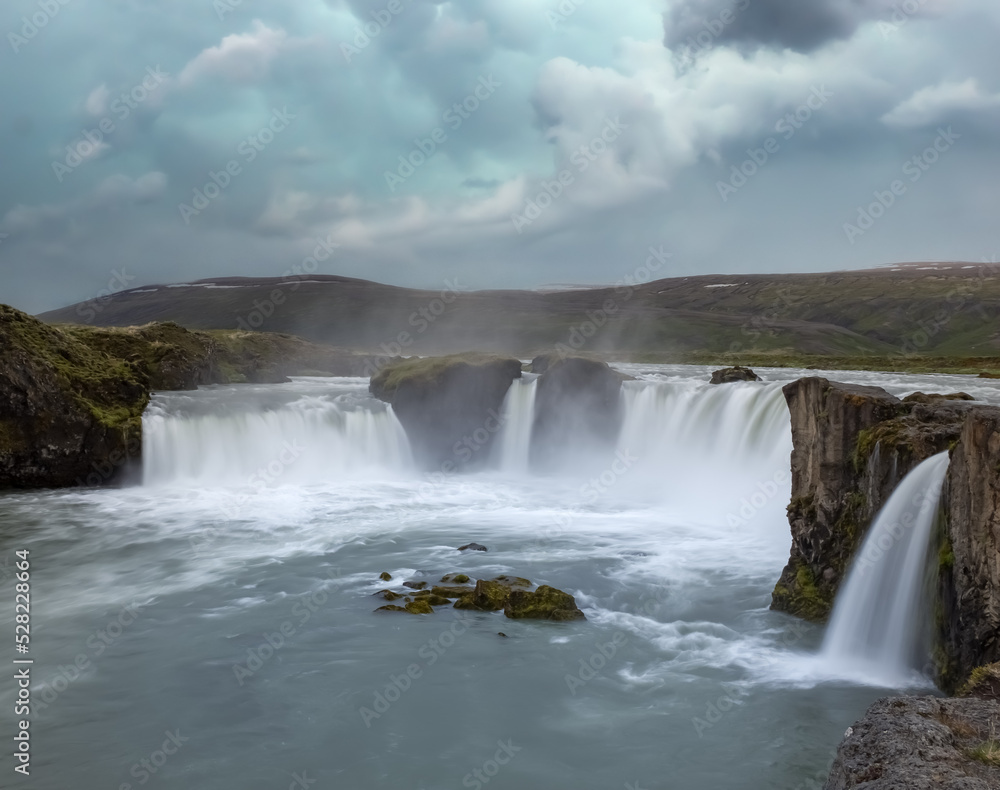 Goðafoss waterfall in northern Iceland, located along the country's main ring road. The water of the river Skjálfandafljót falls from a height of 12 metres over a width of 30 metres. Goðafoss waterfall in northern Iceland, located along the country's main ring road. The water of the river Skjálfandafljót falls from a height of 12 metres over a width of 30 metres.