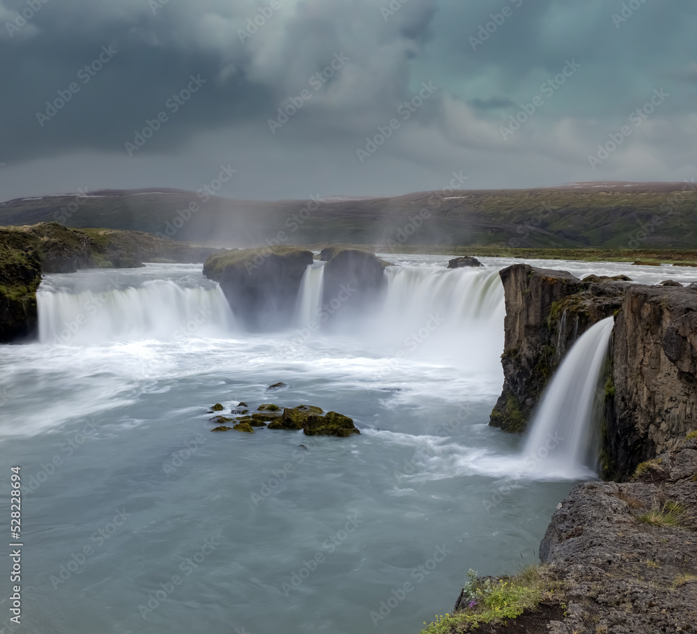 Goðafoss waterfall in northern Iceland, located along the country's main ring road. The water of the river Skjálfandafljót falls from a height of 12 metres over a width of 30 metres. Goðafoss waterfall in northern Iceland, located along the country's main ring road. The water of the river Skjálfandafljót falls from a height of 12 metres over a width of 30 metres.