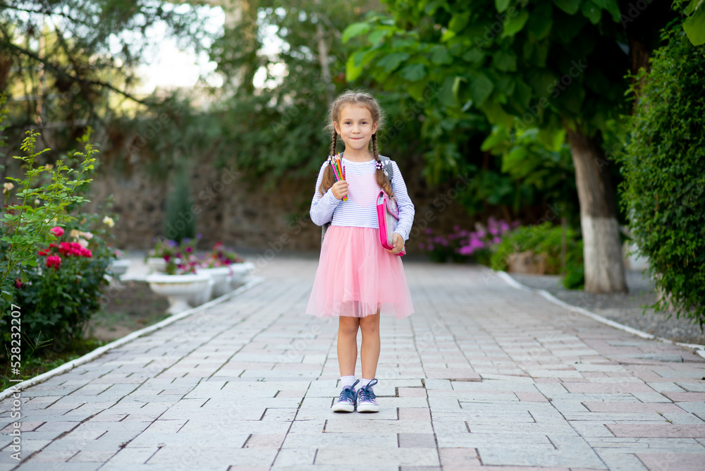 First day at school. A little school girl in first grade. Pupil of primary school. Back to school. First day at school. A little school girl in first grade. Pupil of primary school. Back to school.