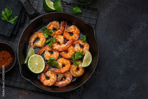 spicy roasted shrimps in cast iron pan