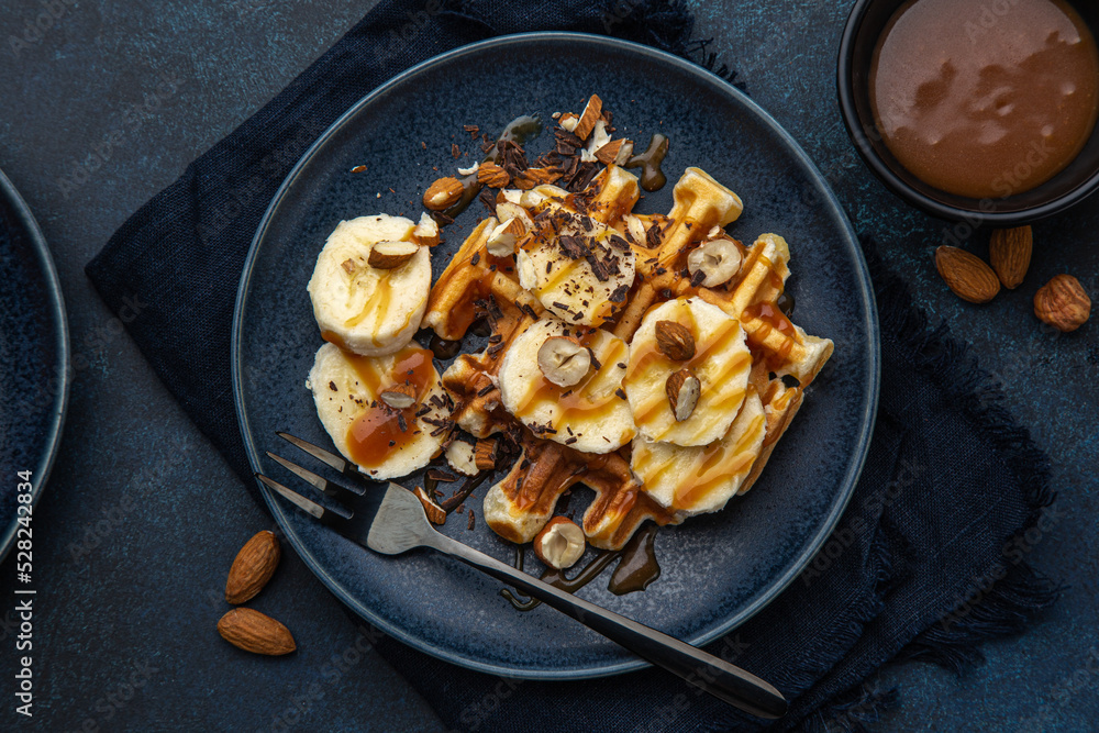 waffles with banana, nuts and salted caramel sauce waffles with banana, nuts and salted caramel sauce
