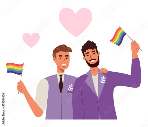 Gay wedding. Two men in love and rainbow lgbt flags. Beautiful men in a tuxedo