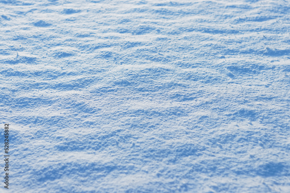 Snow field on sunny day, winter texture