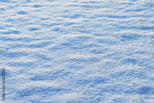 Snow field on sunny day, winter texture
