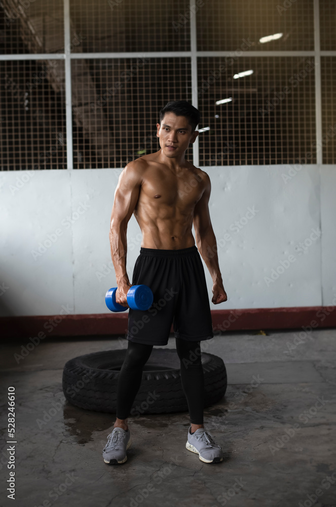 Obraz premium Young man with fit and firm muscle