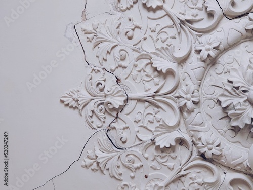 Ceiling of the 19th century house. Russian rural architecture in Vladimir Oblast. Stucco molding and bas-reliefs in Eclectic Pseudo Russe Style photo