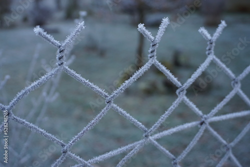 closeup of wire fence covered with hoarfrost in the mountain in france
