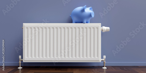Heating cost saving. Piggy bank on heater radiator, warm house room interior photo