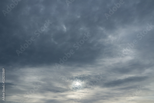 Photo of sun through stormy clouds.