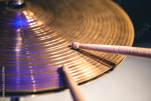 Slika na platnu Close-up of drumsticks on a cymbal drum.
