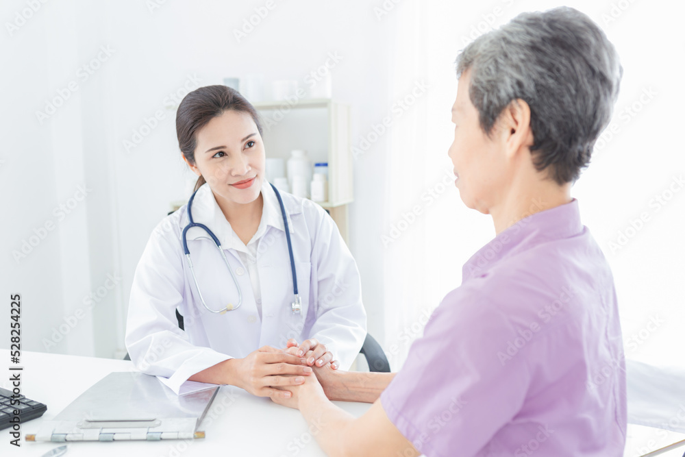light and blue people, asian female doctor holding hand of old patient in mental health clinic, patient have a problem health in hospital, hand in hand, elderly healthcare promotion light and blue people, asian female doctor holding hand of old patient in mental health clinic, patient have a problem health in hospital, hand in hand, elderly healthcare promotion