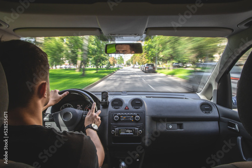 Hands on the wheel when driving at high speed from inside the car. © puhimec
