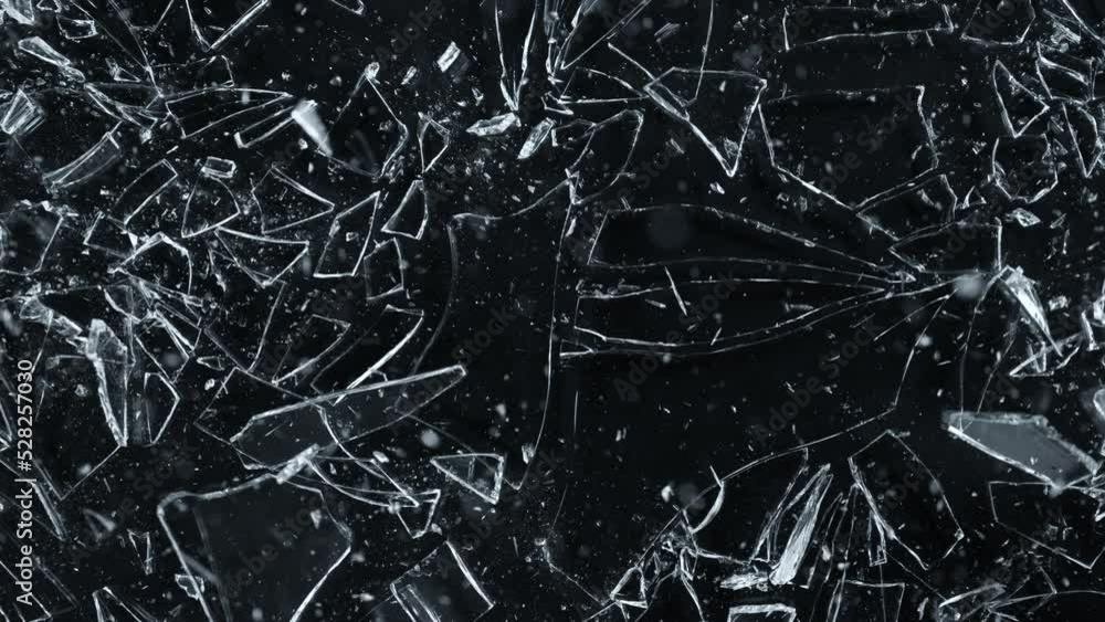 Super Slow Motion Shot of Breaking Real Glass at 1000 fps. Isolated on Black Background. Super Slow Motion Shot of Breaking Real Glass at 1000 fps. Isolated on Black Background.
