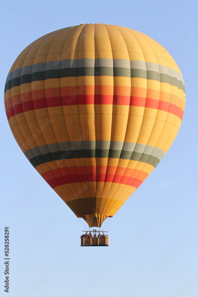 Hot air baloon flying above savannah planes in Maasai Mara Kenya Hot air baloon flying above savannah planes in Maasai Mara Kenya