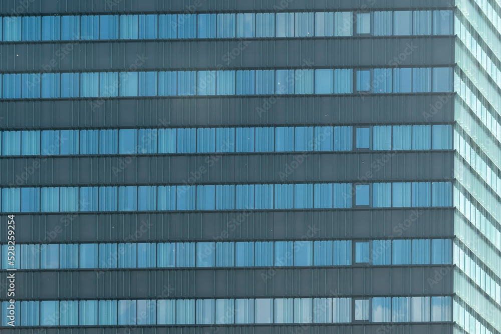 architecture of the building  with lots of windows - obrazy, fototapety, plakaty 