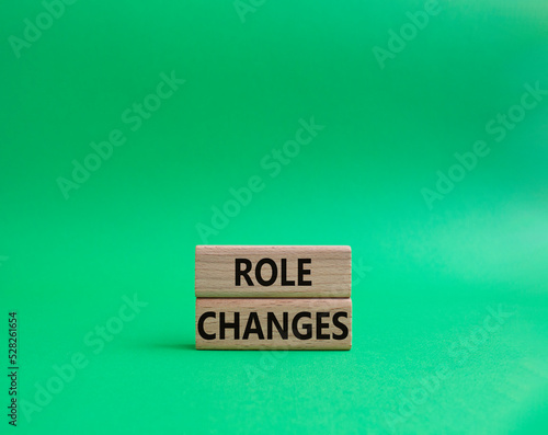 Role changes symbol. Concept words Role changes on wooden blocks. Beautiful green background. Business and Role changes concept. Copy space.