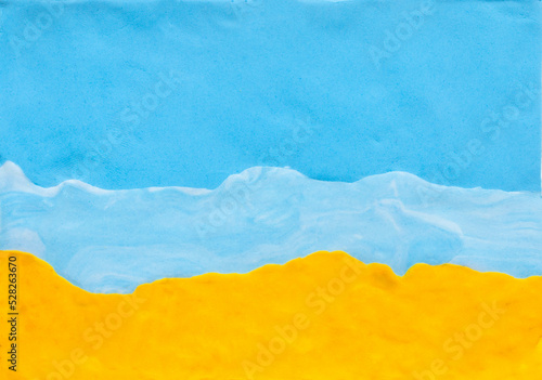 Sea and sand made from blue yellow plasticine. concept holiday texture  beach sea background