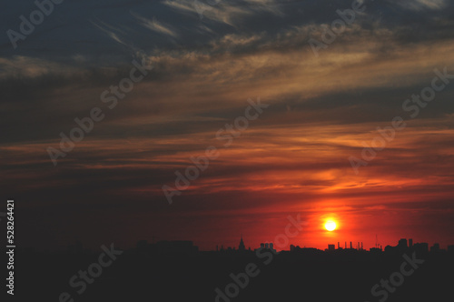red crimson sunset on the skyline of the city landscape