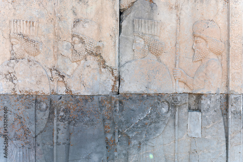 Bas-relief decoration along stairs from Darius palace to Palace of Xerxes. Ancient ruins of Persepolis near Shiraz in southern Iran. This UNESCO World Heritage Site showcases beautiful ruins from the 
