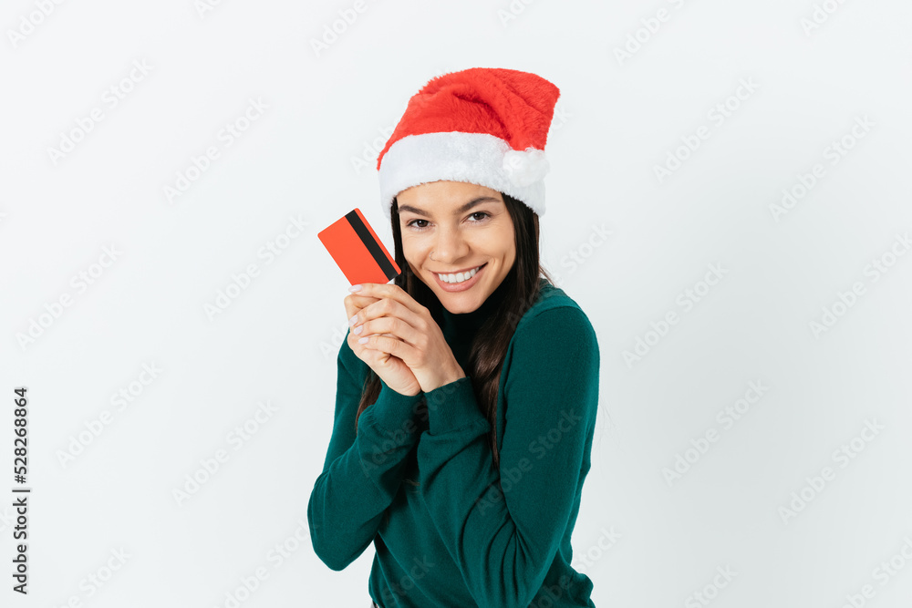 Happy excited brunette woman wearing red santa hat