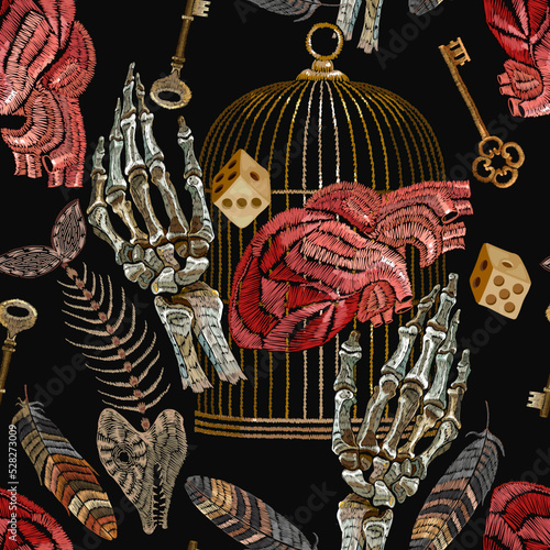 Embroidery. Skeleton hands, golden cage, anatomical heart, dice, fish bone and keys. Romantic gothic background. Seamless pattern. Template for clothes, textiles, t-shirt design
