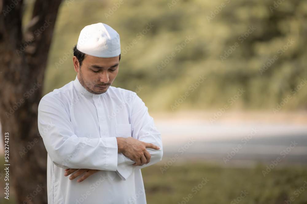 Asian islam man prayer,Young Muslim praying,Ramadan festival concept Asian islam man prayer,Young Muslim praying,Ramadan festival concept